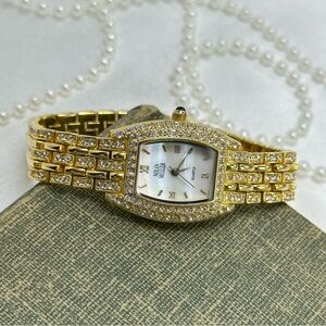 Elegant Crystal Gold Nolan Miller Watch with Mother of Pearl Dial